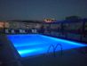 Athens, Greek capital - 옥상 수영장은 밤에는 파란색으로 켜져있다.