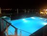 Novotel Athens - Rooftop pool illuminated at night