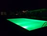 Radisson Blu Park Hotel Athens - rooftop pool illuminated in green at night